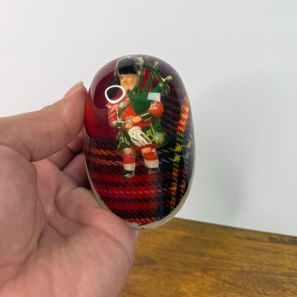 Vintage Scottish Bag Piper Paperweight Plaid Background